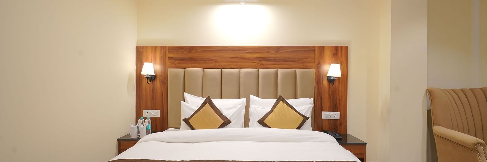 A large bed in Premium Room at DLS Oak Bush, Musssoorie.