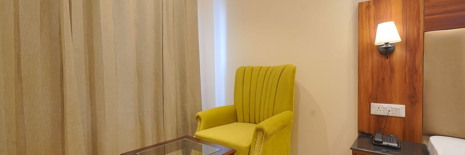 A sofa in front of the table at Premium Room at DLS Oak Bush, Musssoorie.