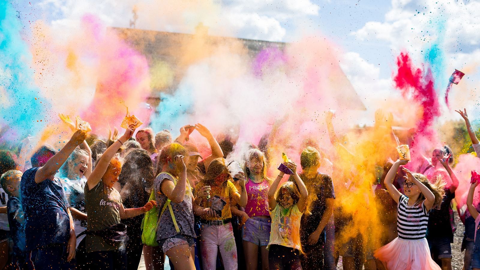 kids smearing colours on each other