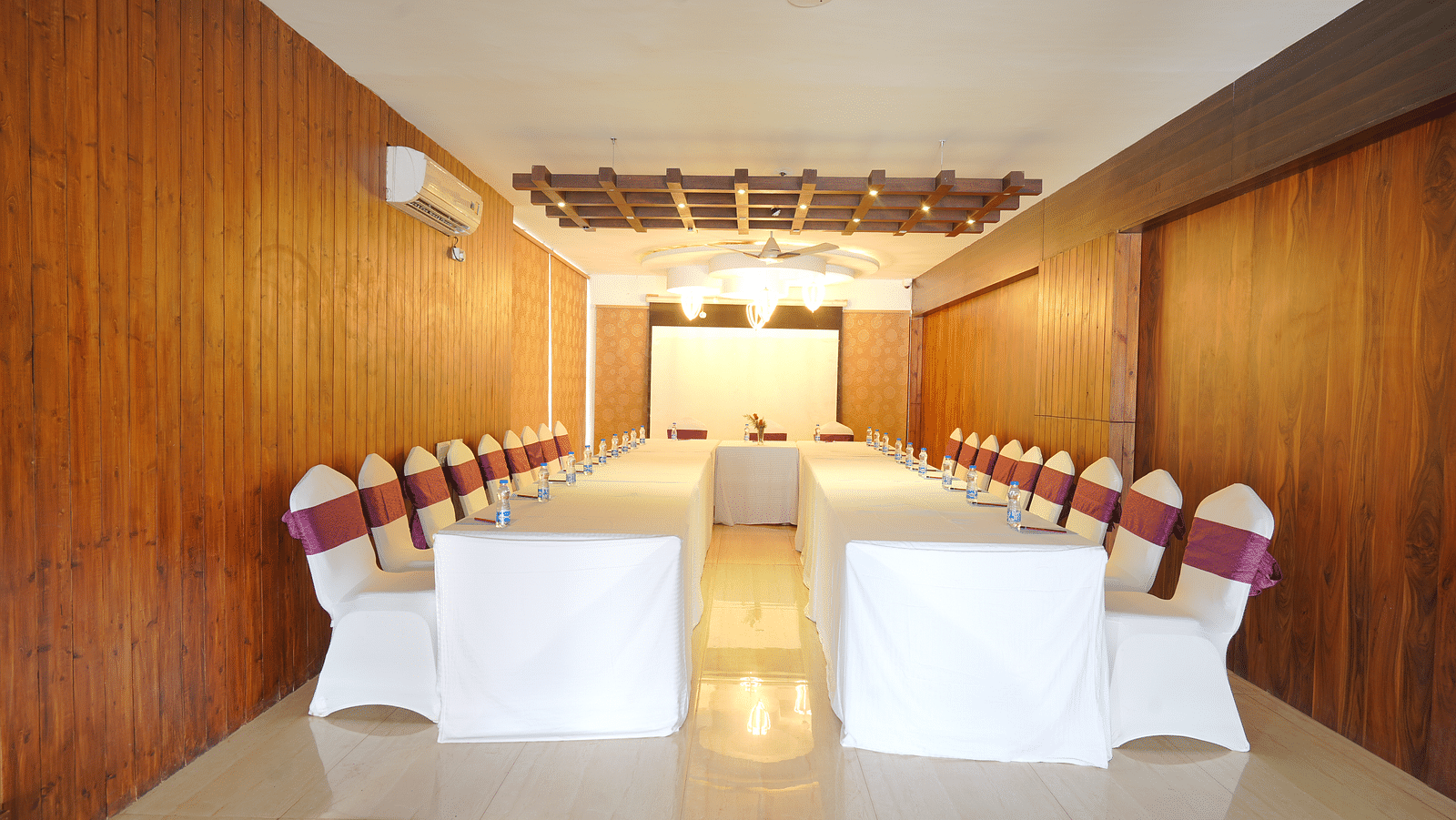 The image of the conference hall at DLS Whispering Winds with u-shaped seating arrangement
