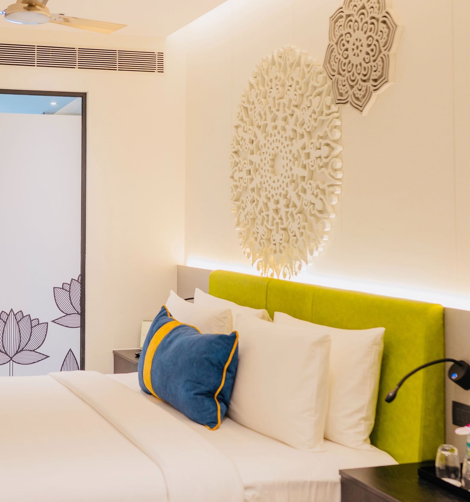 side view of a bedroom with tea and coffee maker at Zibe Luxe Kakinada by GRT Hotels