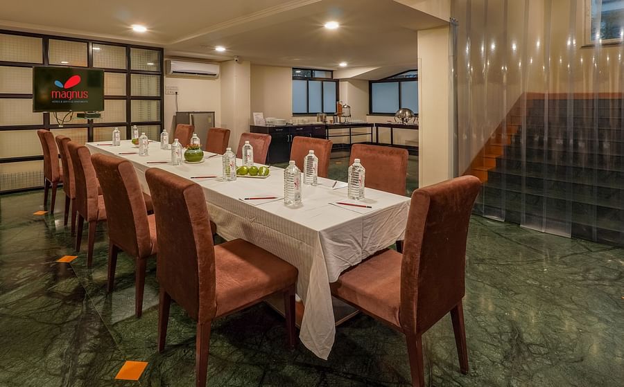 Restaurant with brown dining chairs and glasses on table