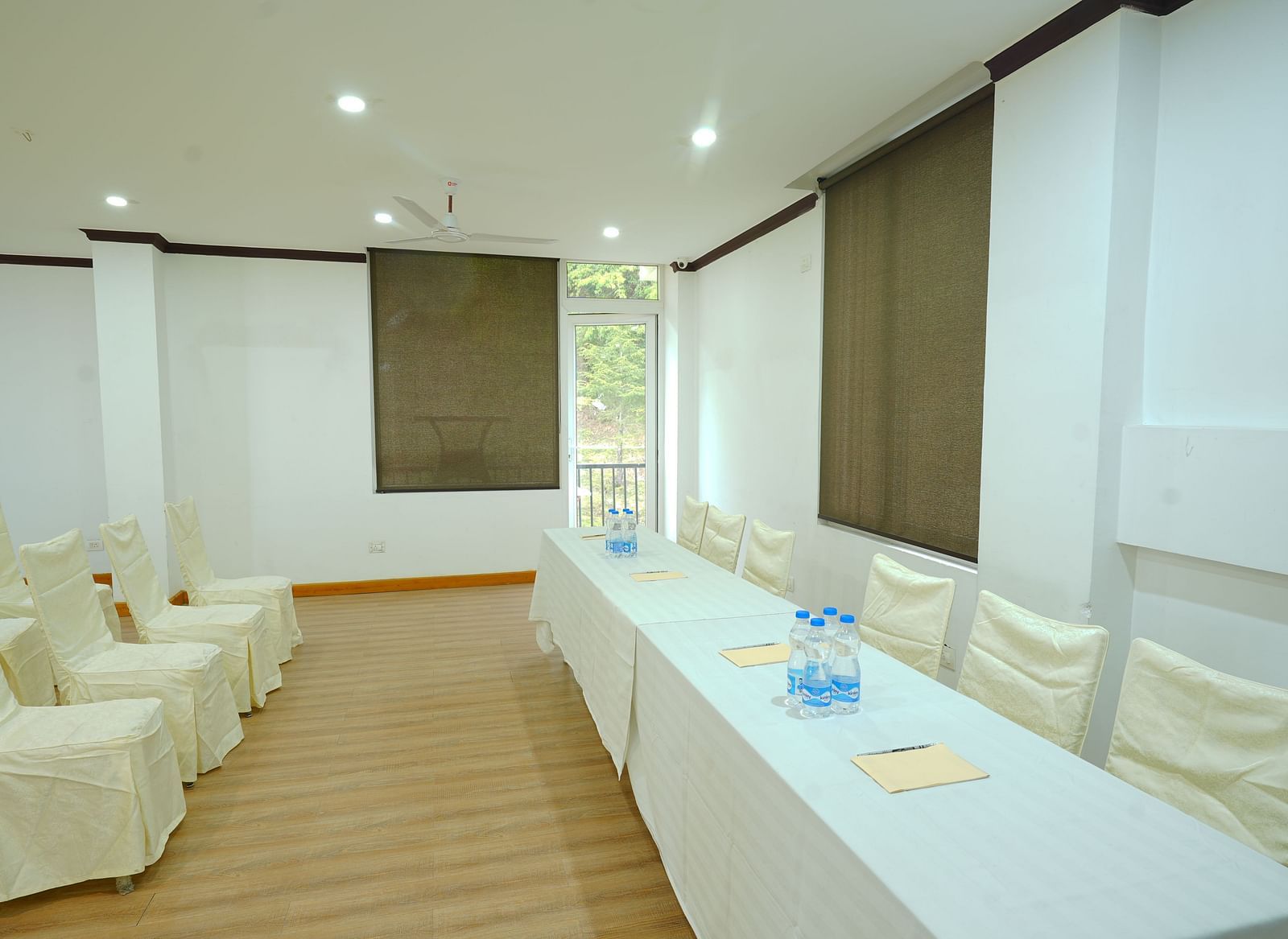 A large conference room with a long table and chairs set up for a meeting | DLS Hotel Shiva Sanctuary & Spa, Dharamshala