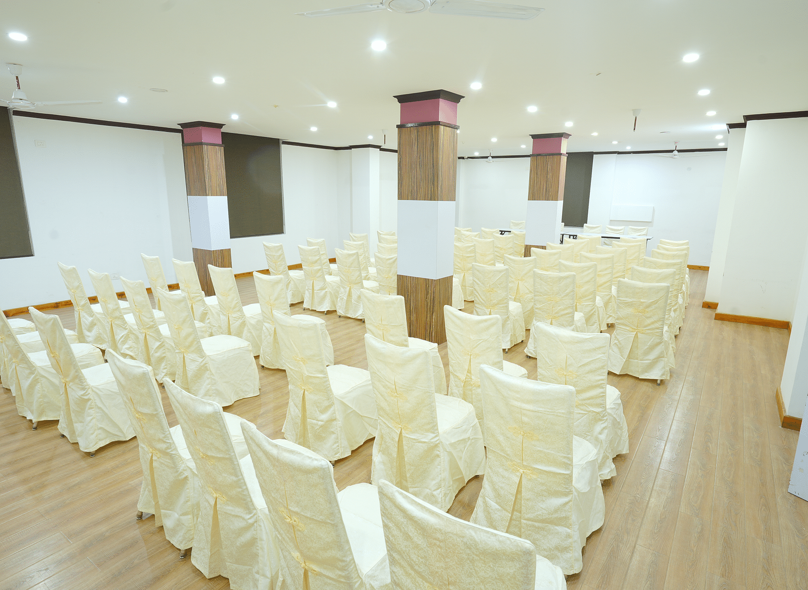 A large banquet hall with rows of chairs set up for a large gathering | DLS Hotel Shiva Sanctuary & Spa, Dharamshala