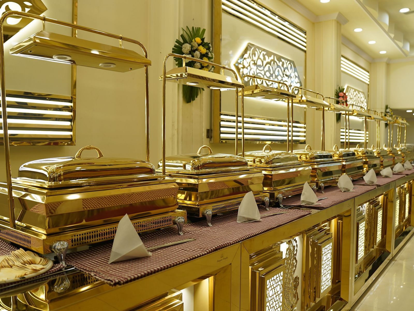A photograph of a banquet hall in Roorkee featuring a chandelier and a buffet setup - Motel Divine International, Roorkee