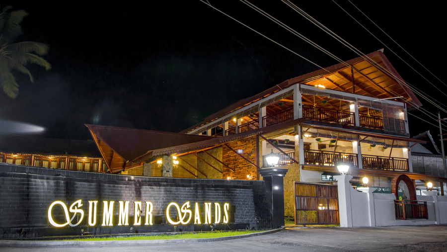 Facade of Symphony Summer Sand Beach Resort And Spa, the best resort resort in Neil Island, Andaman, with the signage Summer Sands written on its walls.