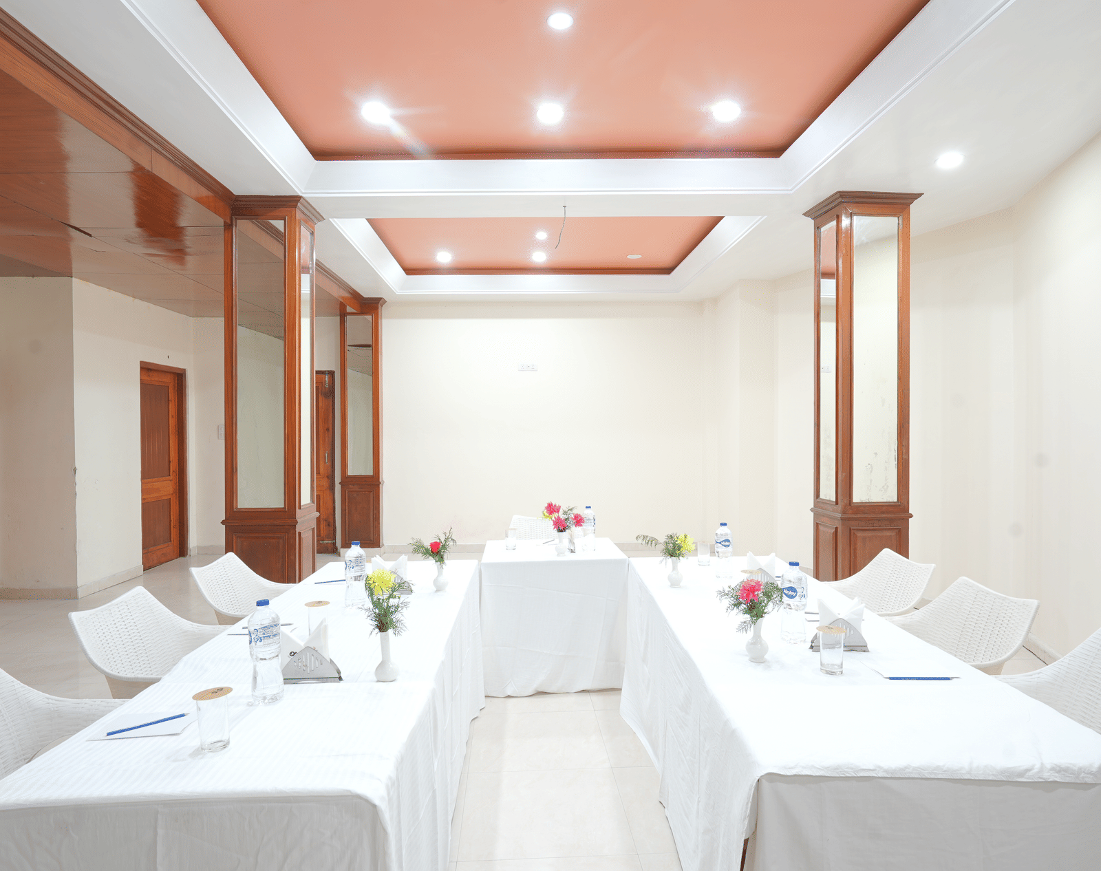 Conference hall featuring neatly arranged chairs and tables at DLS Hotels The Rock Castle.