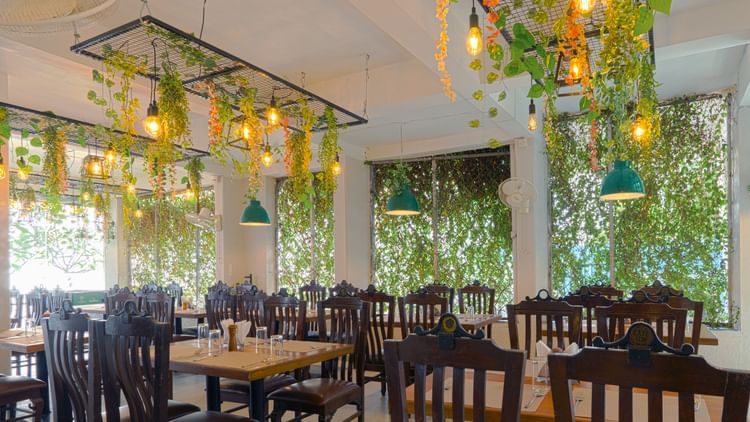 Puiicture featuring the dining area, well arranged tables and chairs - Magnus Aerith Studio, Kharadi