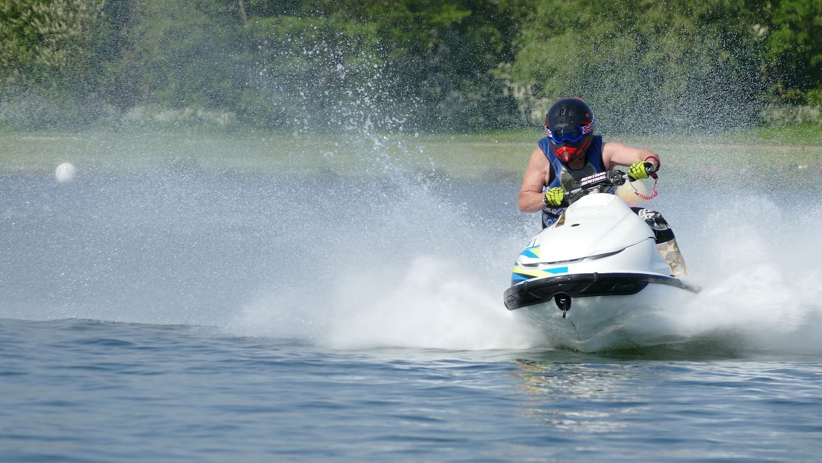 A person speed boating on a lake
