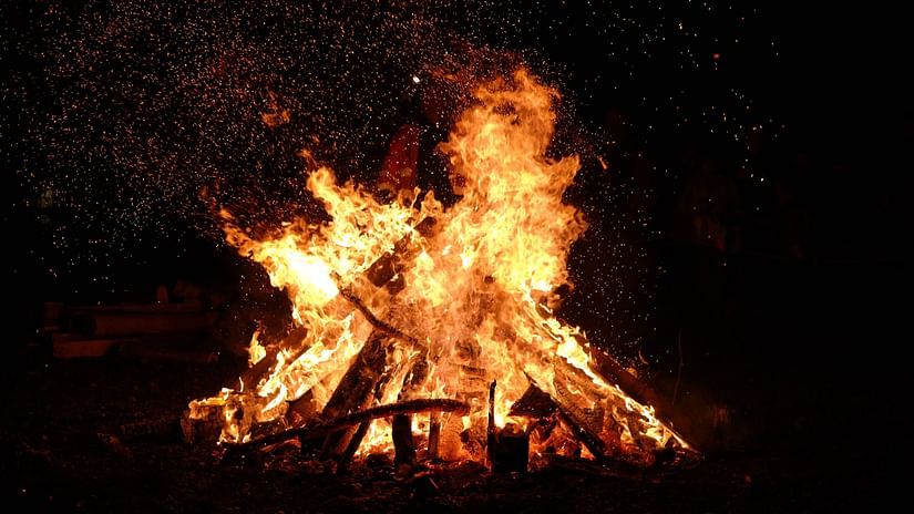 A close up shot of a bonfire raging in the night - Abad Copper Castle, Munnar
