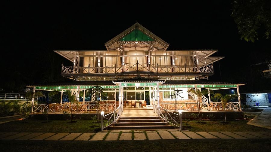 A picture featuring the exterior of the well lit building in the night