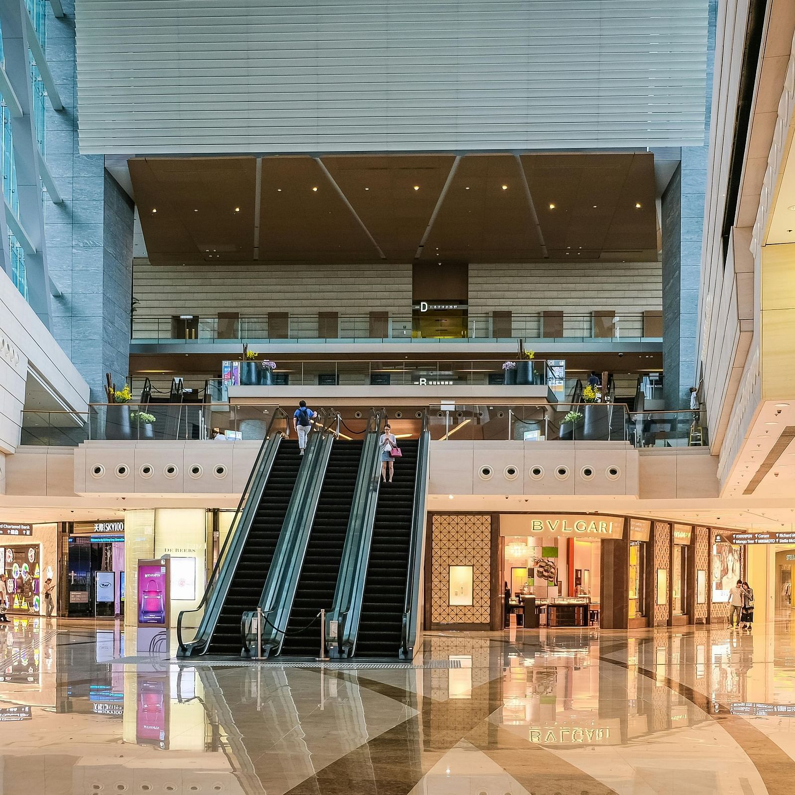 Escalators in the centre of a mall leading up to the first floor