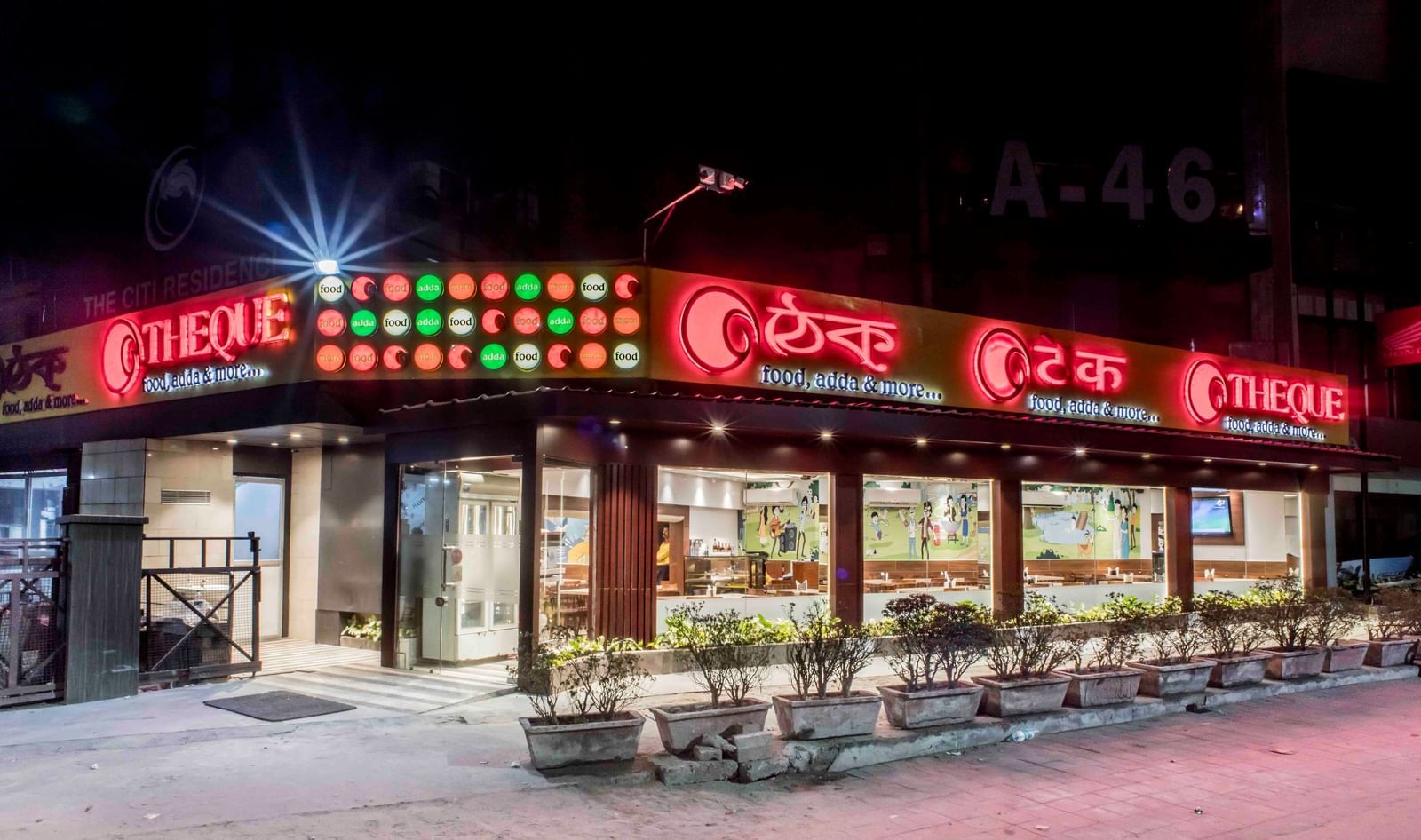 The exterior facade of a restaurant or dining venue at night, part of The Citi Residenci Hotel, Durgapur.