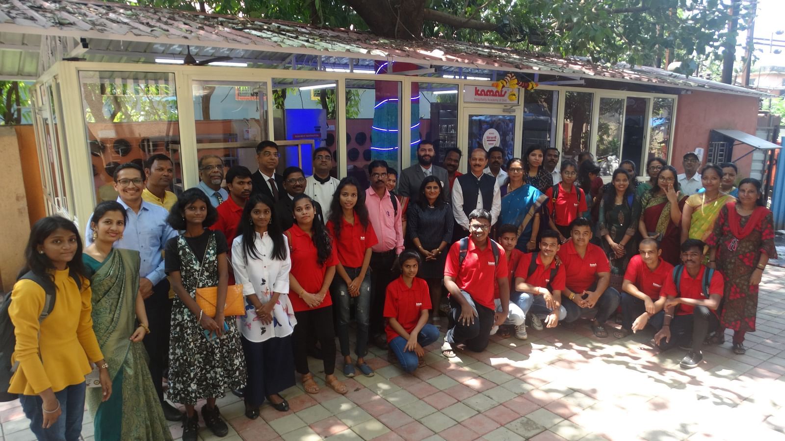 Group photo of students and staff outdoors near the newly inaugurated facility at Achievers College - Kamats India