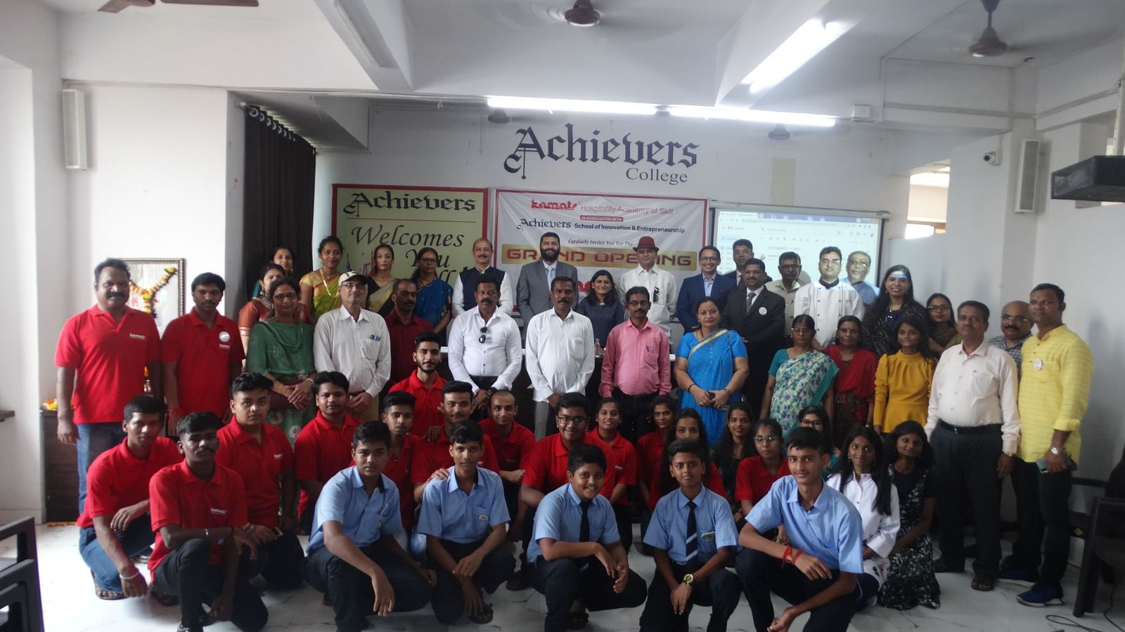 A larger group photo including students, staff, and guests at Achievers College for the grand opening of a new programme - Kamats India