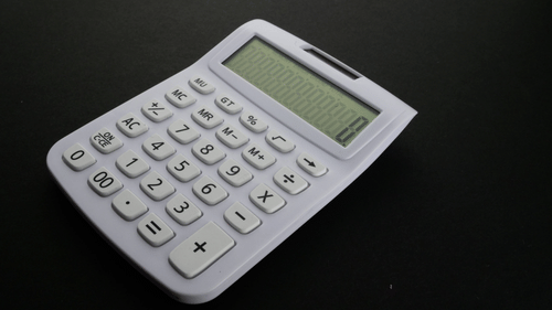 image of a white coloured calculator
