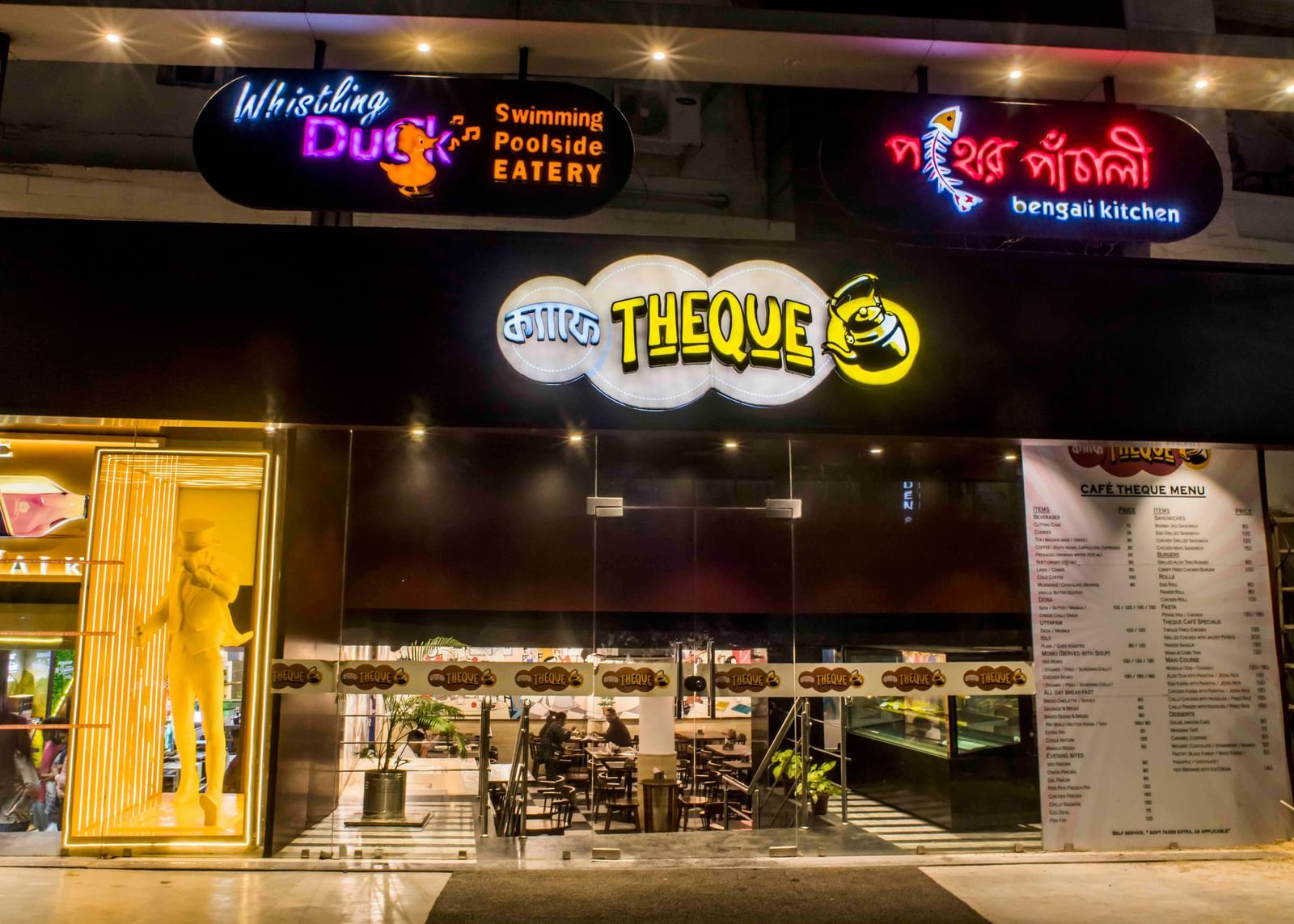 The exterior facade of a restaurant or dining venue at night, part of The Citi Residenci Hotel, Durgapur.