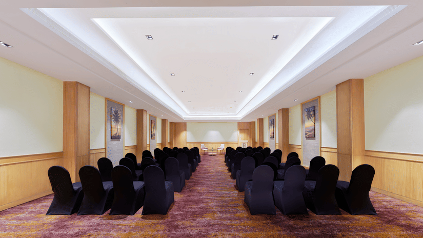 An overview of the Harbour Hall with chairs facing towards the stage | The Resort, Mumbai
