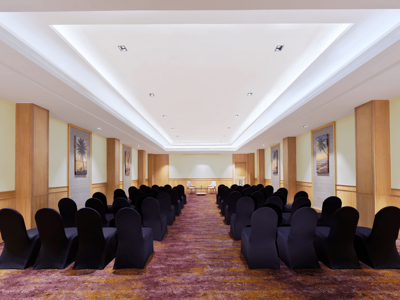 An overview of the Harbour Hall with chairs facing towards the stage | The Resort, Mumbai