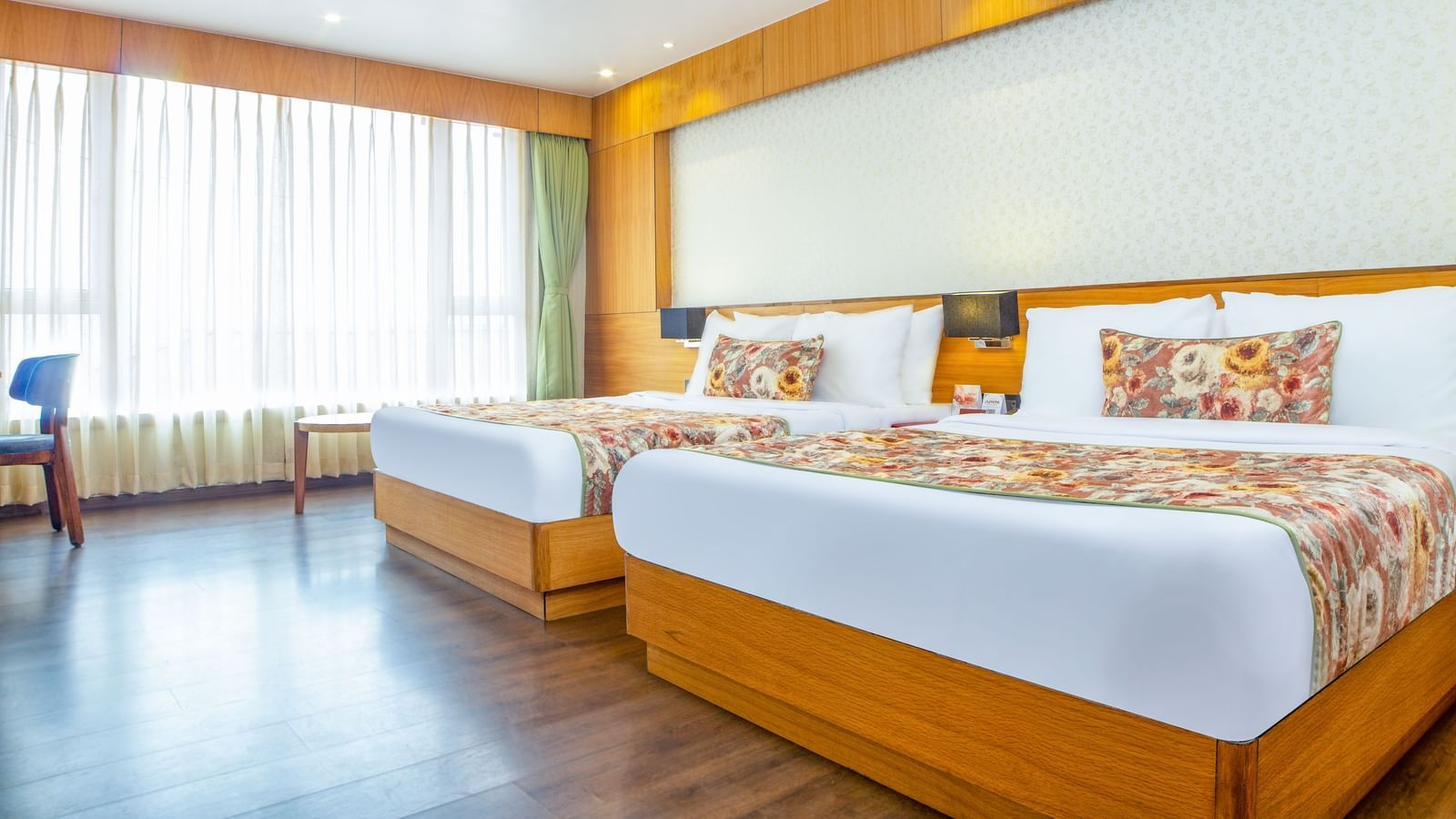 Premium Family Suite with spacious twin beds and wall mounted televison along with large windows