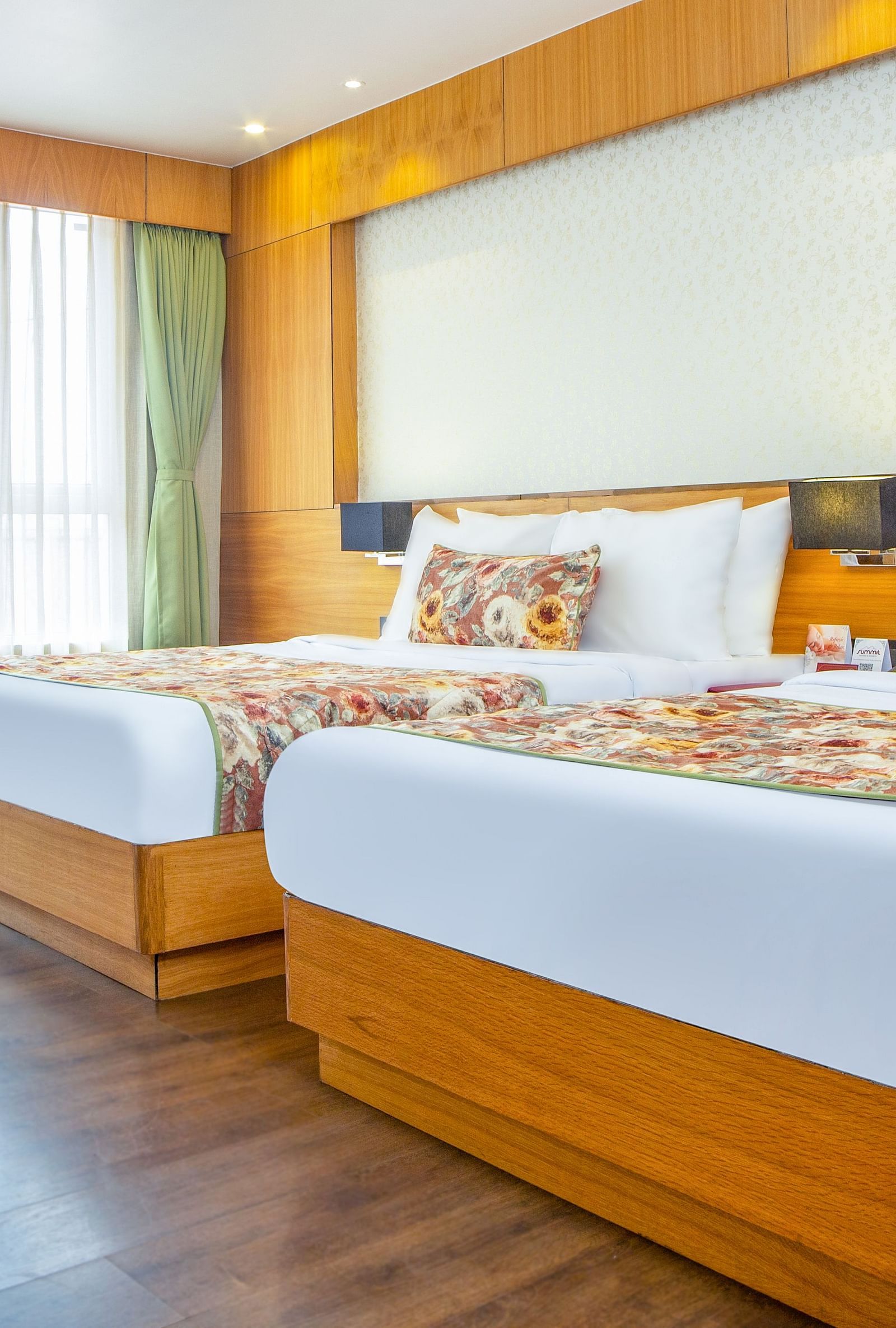 Premium Family Suite with spacious twin beds and wall mounted televison along with large windows