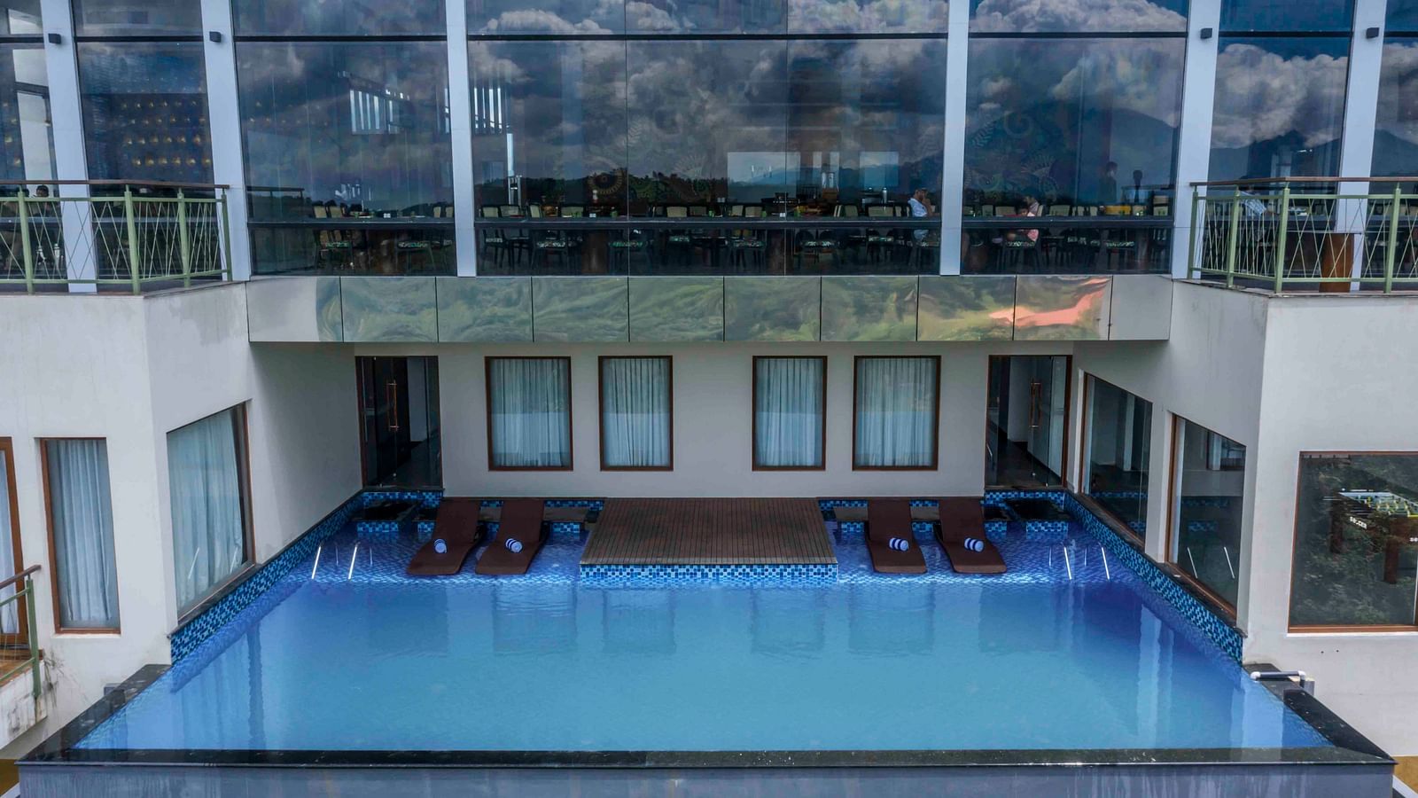 Image of  a swimming pool inside our hotel | Great Trails Wayanad by  GRT hotels.