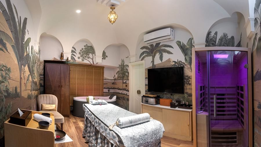 An image of the Cinqtuair Spa in New Delhi with a table placed in front of a television screen - The Claridges New Delhi