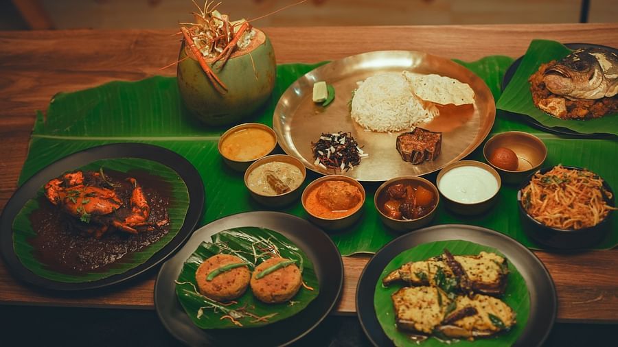 image featuring a bengali thali with several side dishes along with a huge spread of authentic bengali cuisine - Dip Holidays, Birbhum