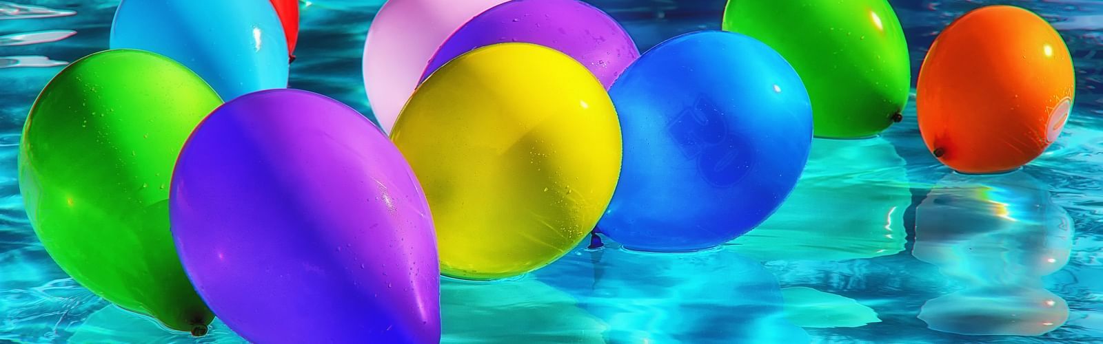 mutl-coloured balloons on a water