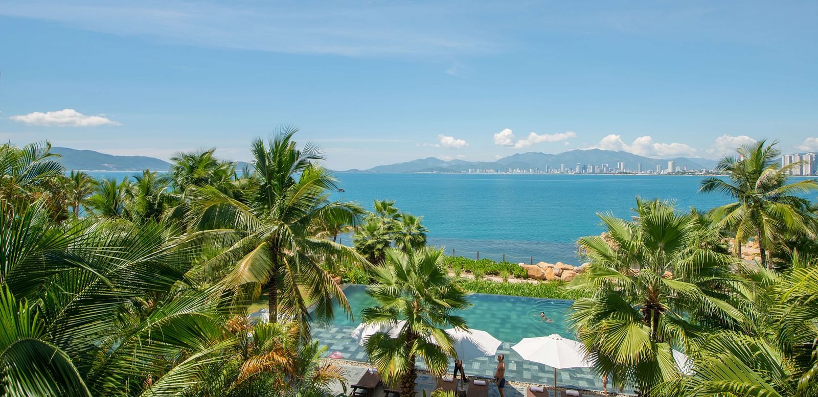 An aerial view of the pool at our resort with a view of the beach near the pool - Alibu Resort Nha Trang