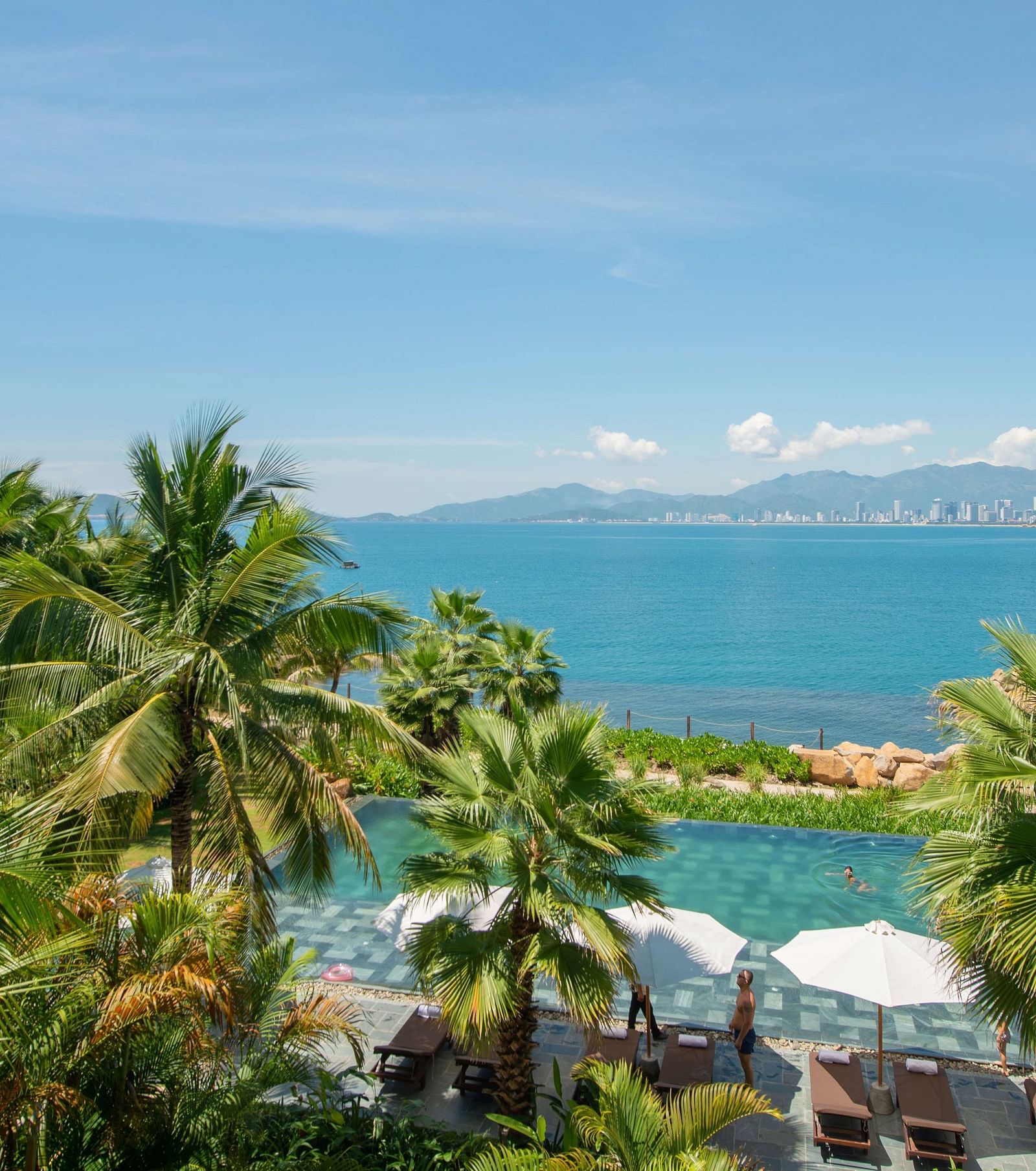An aerial view of the pool at our resort with a view of the beach near the pool - Alibu Resort Nha Trang