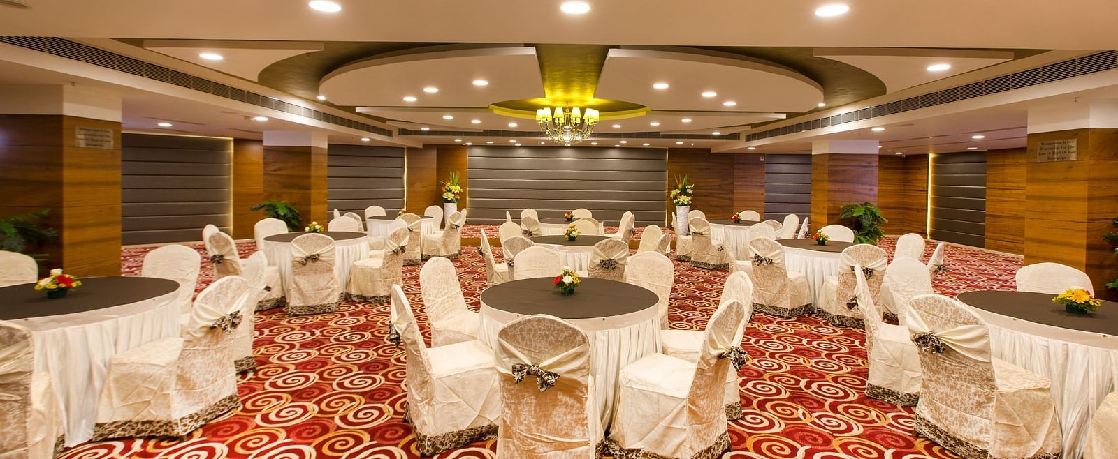 Round table seating arrangements inside Orion Hall Hotel Pai Viceroy Tirupathi 