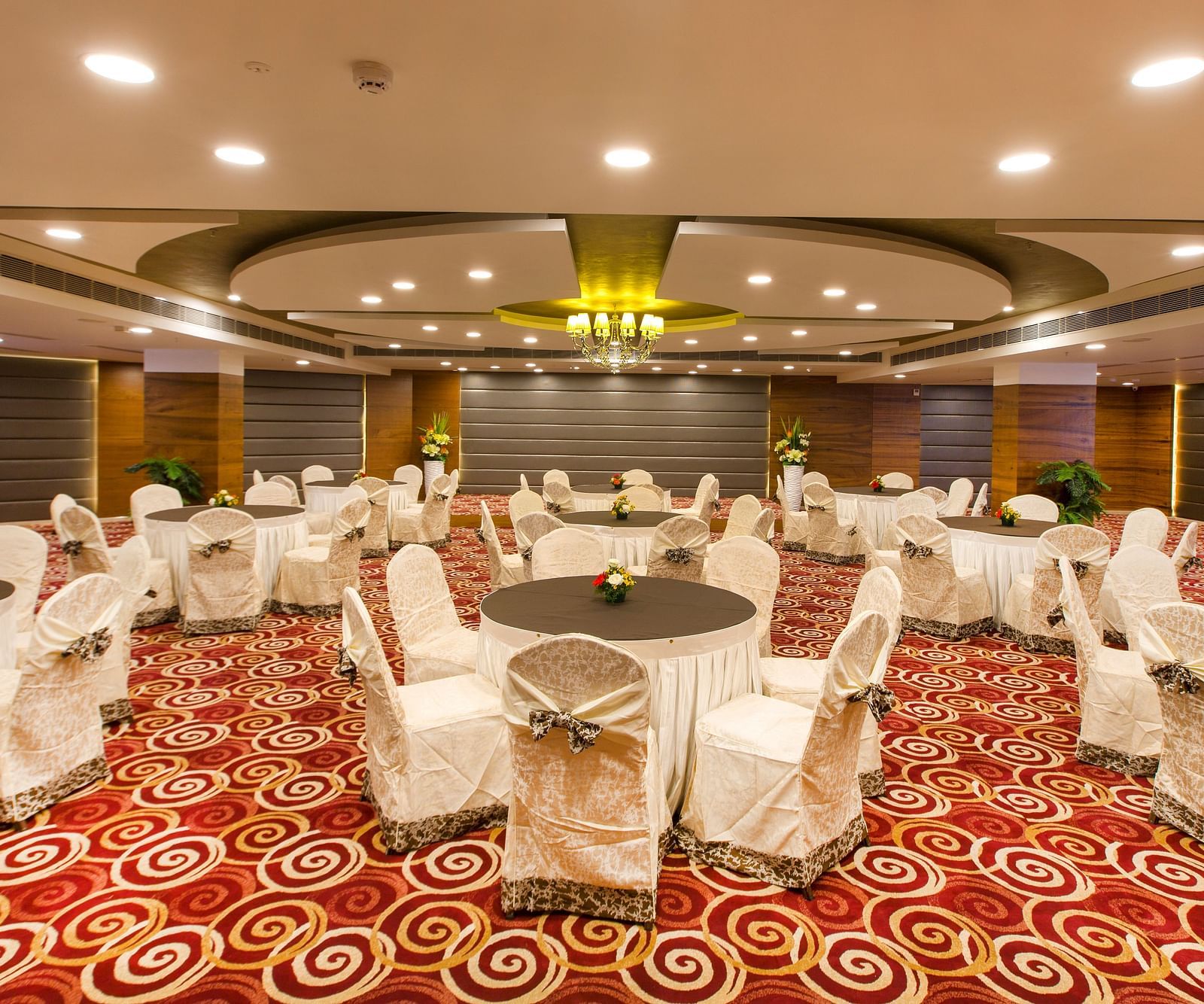 Round table seating arrangements inside Orion Hall Hotel Pai Viceroy Tirupathi 