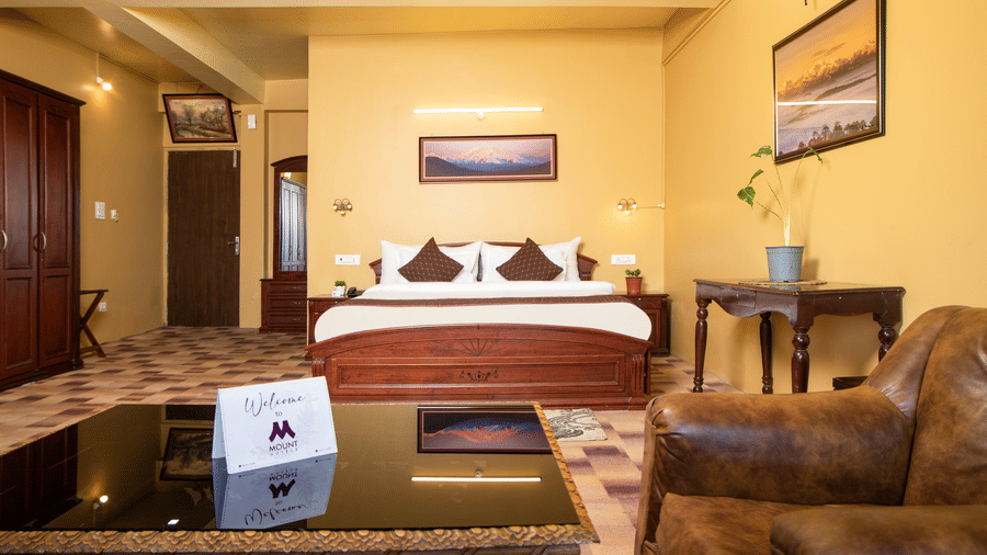 Junior Suite bedroom at Mount Queens Hill Lake Resort and Spa Mirik