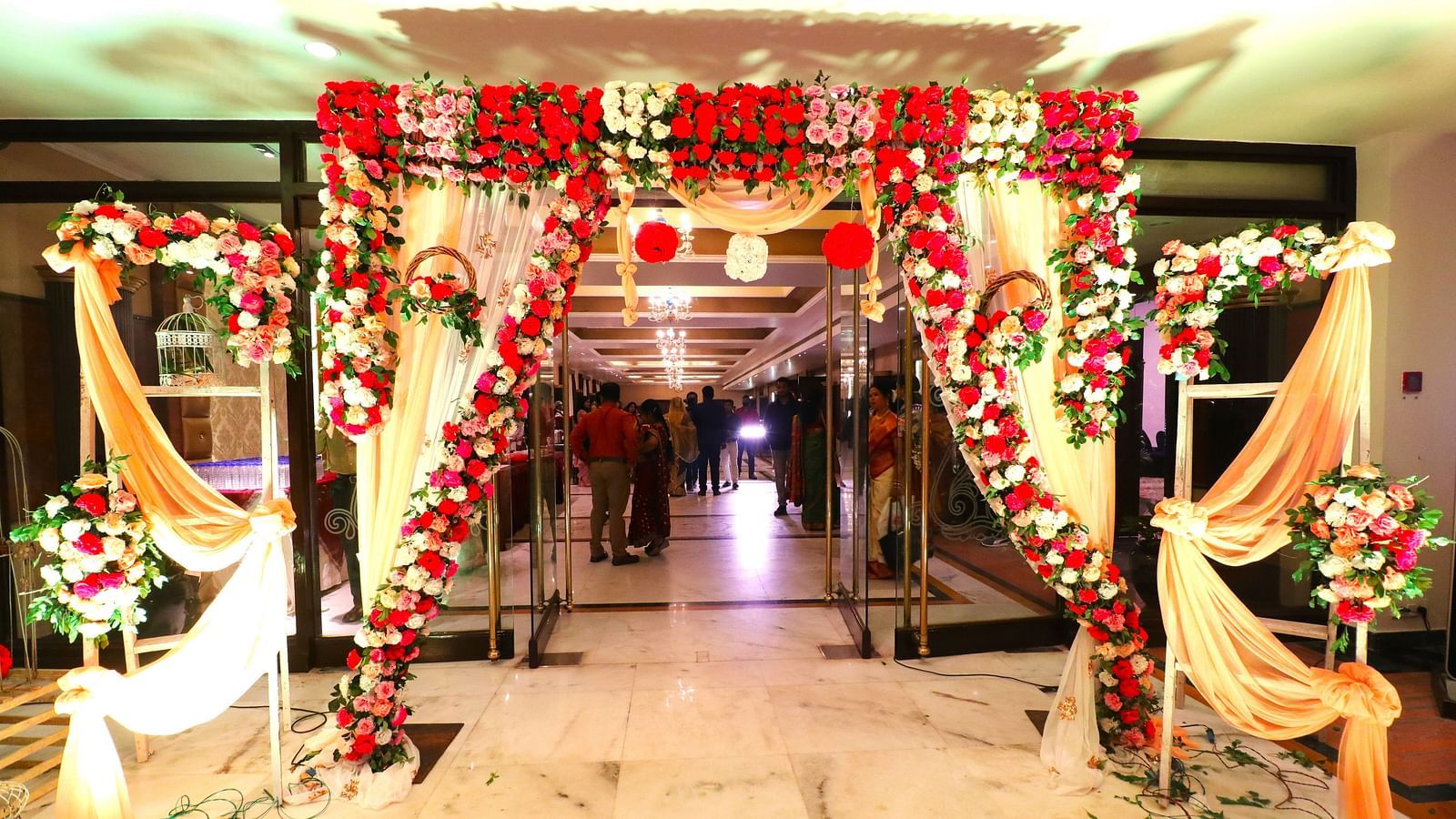 Banquet hall illuminated with bright lights, fully decorated to create an ideal atmosphere for celebrations.