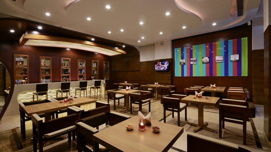 Restaurant with  wooden tables and chairs , decor and lighting 