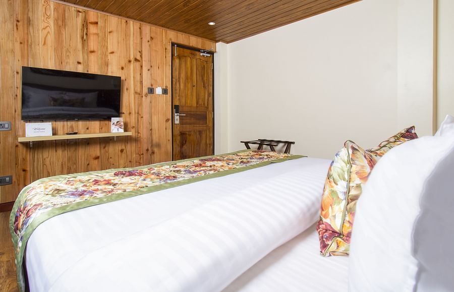 Side view of Suite With Balcony room with TV mounted on the wall at Mount Lungta Boutique Hotel & Spa