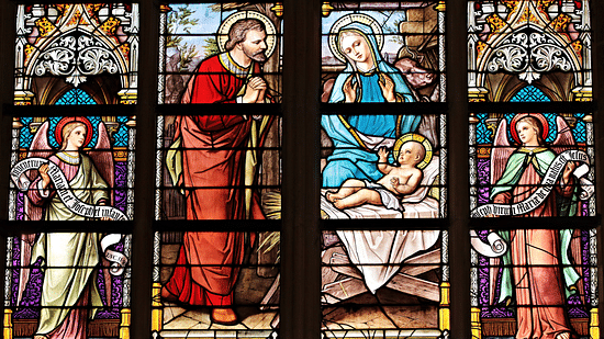 Coloured windows showing the birth of Jesus Christ