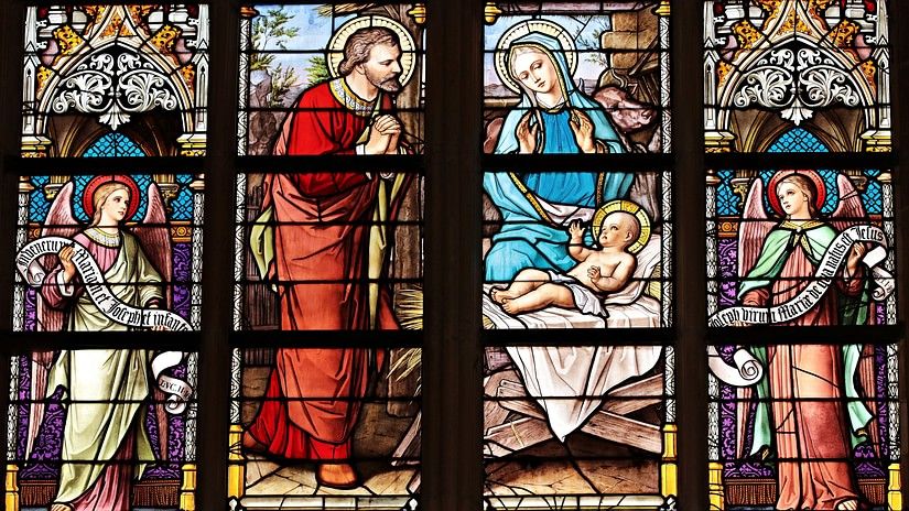 Coloured windows showing the birth of Jesus Christ