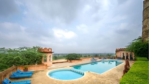 Hill Fort Kesroli 14th Century Alwar - aerial shot of the Swimming pool in an Alwar fort resort