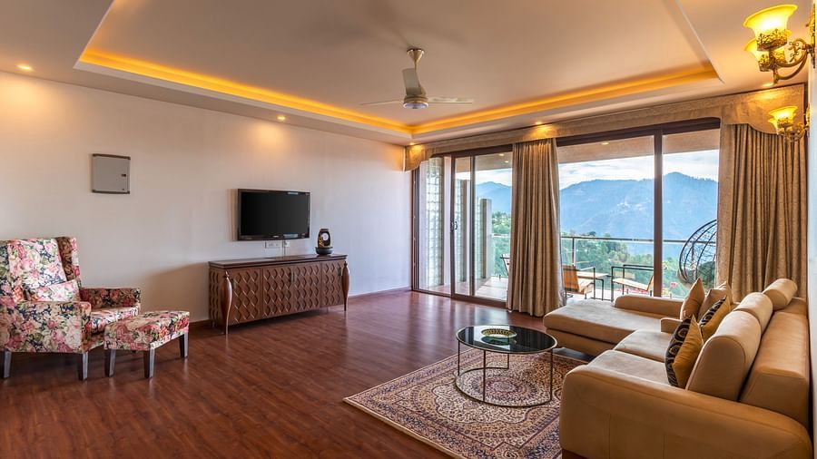 The Manor Shimla - The interiors of the living area with sofa and television