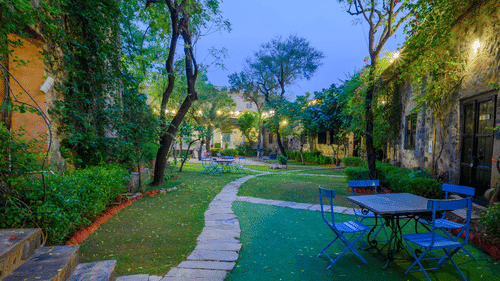 Hill Fort Kesroli 14th Century Alwar - view of a passage with grass and trees on either sides