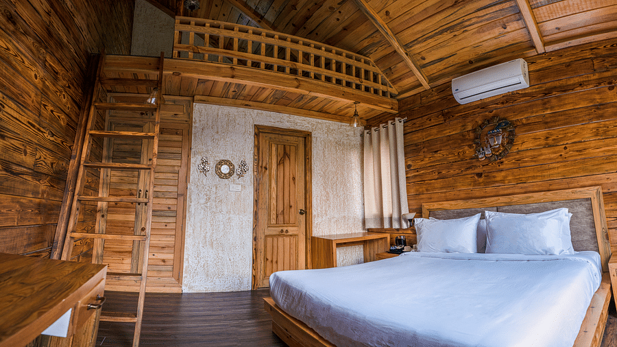 A view of the large bed at Pinewood Cottage at the Sylvan Retreat, Dehradun.