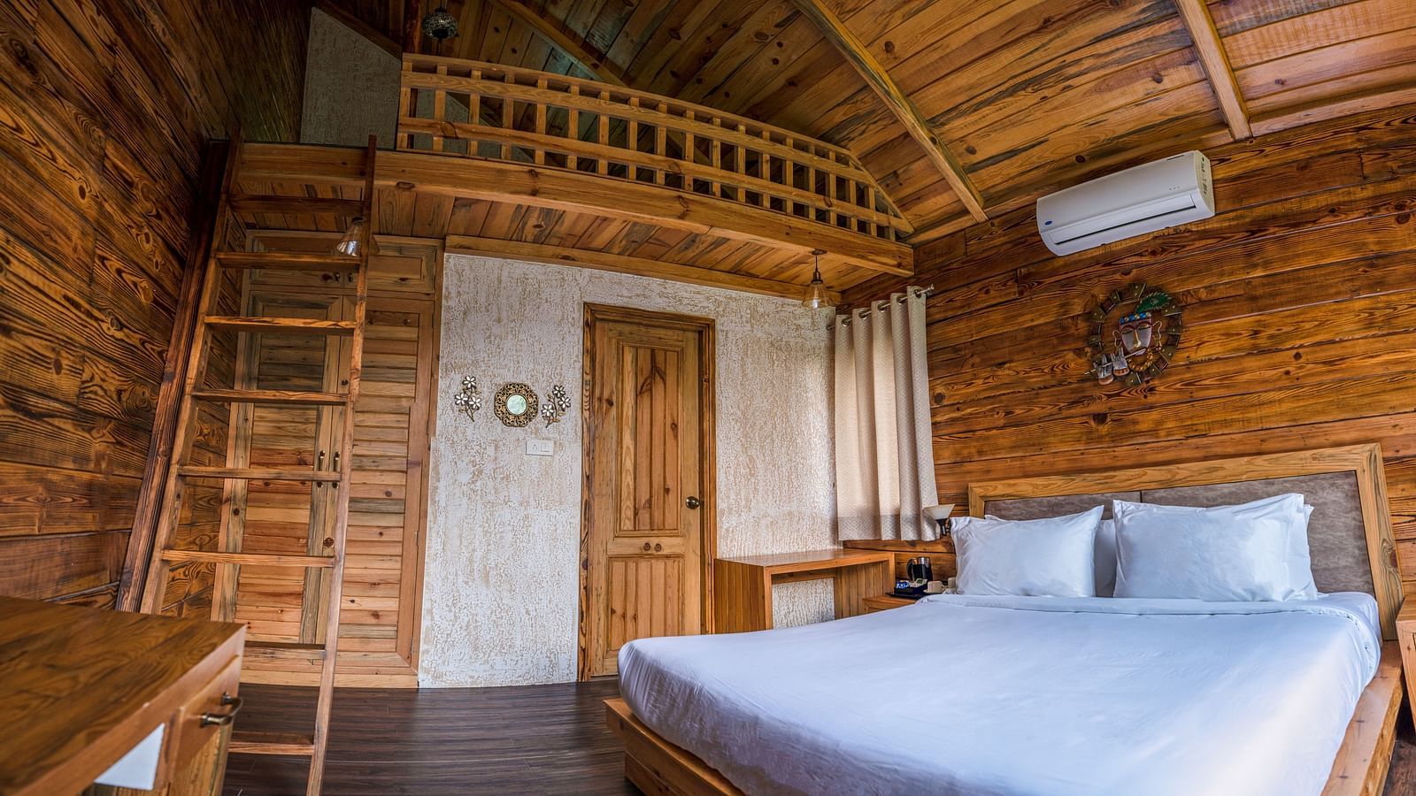 A view of the large bed at Pinewood Cottage at the Sylvan Retreat, Dehradun.