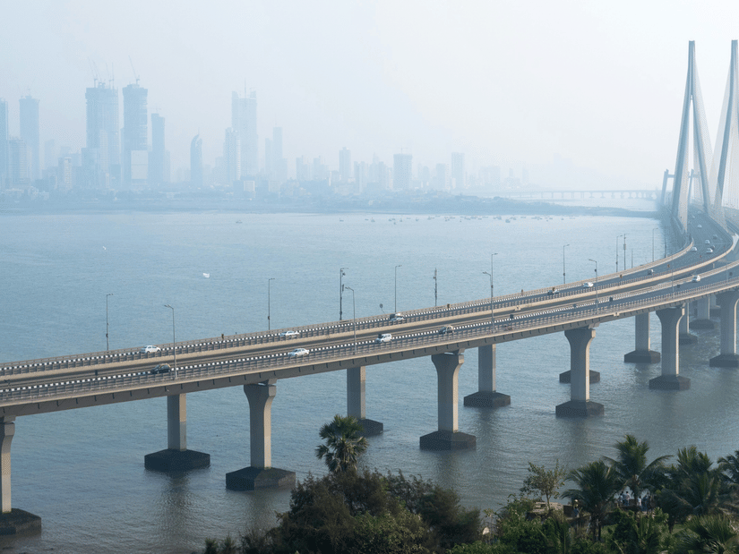 Aerial view of Bandra-Worli Sea Link bridge stretching across the Arabian Sea with Mumbai city skyline in the background