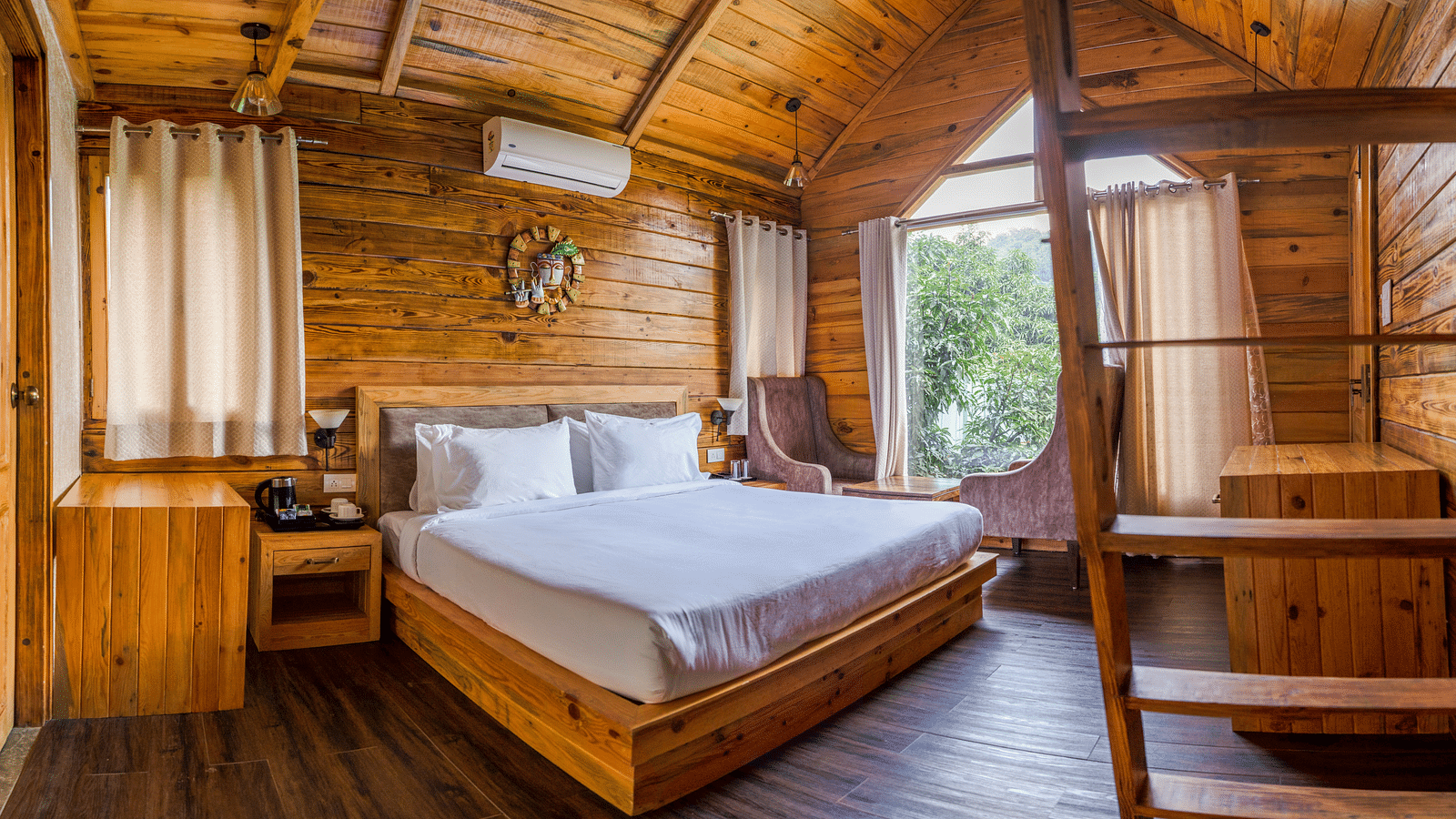 A view of the large bed at Pinewood Cottage at the Sylvan Retreat, Dehradun.