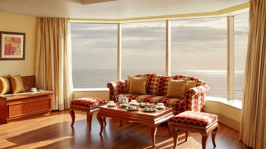 seating area in one of the rooms at Ramada Plaza Palm Grove 3948