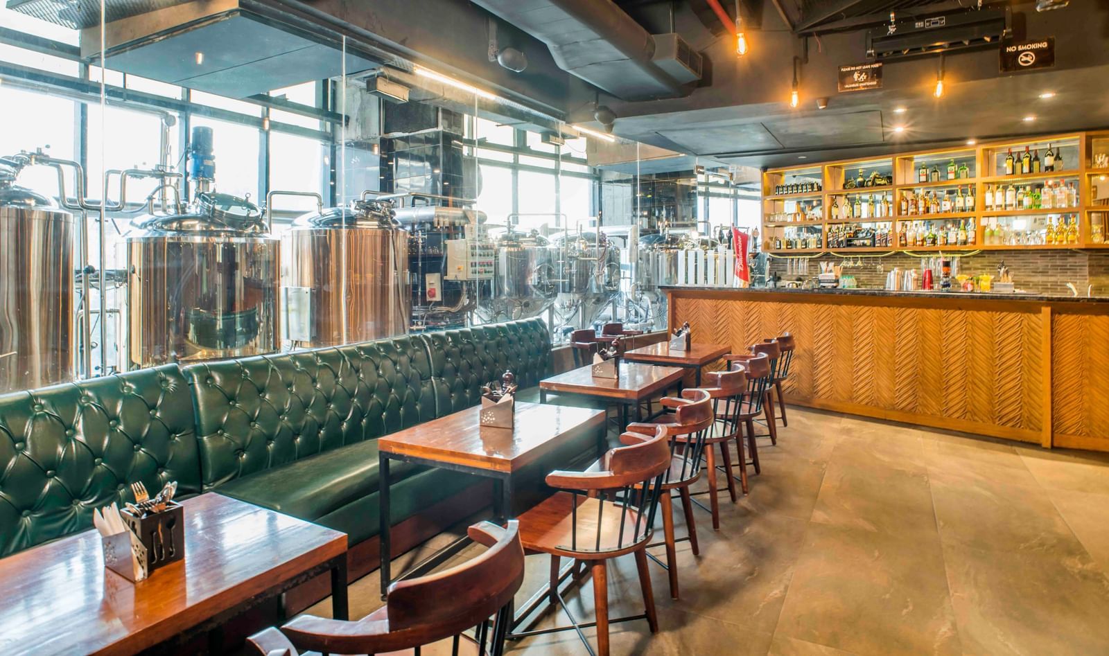 The interior of a bar or restaurant with seating at The Citi Residenci Hotel, Durgapur.