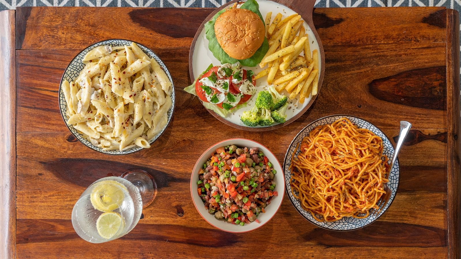 a table set with a variety of food - Neer Ganga Resorts