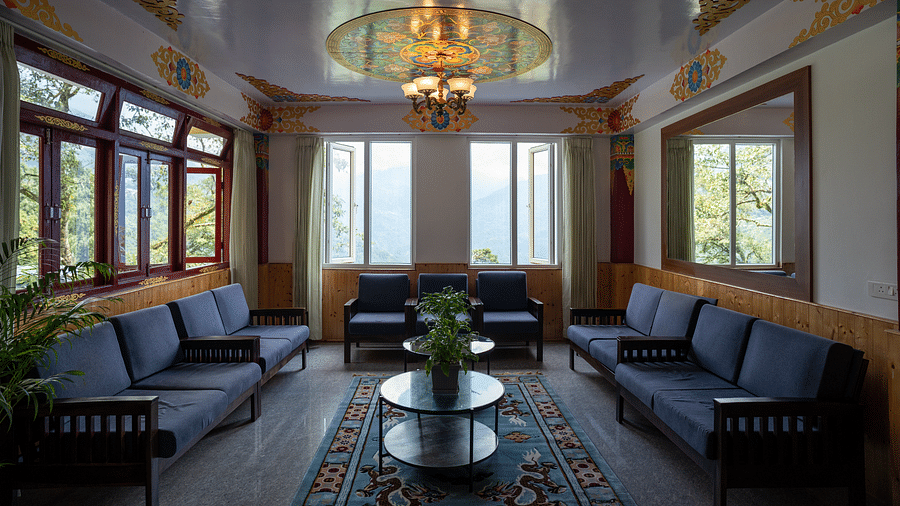 Sofas and coffee tables in a closed hall with glass windows | Voyage The Royal Retreat